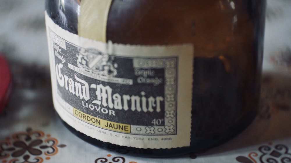 a close up of a bottle of beer on a table