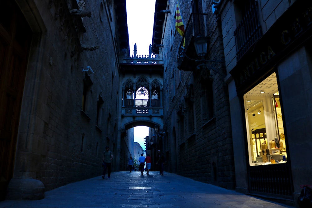 10 Top Places to Visit in Barcelona 2 people walking on pathway between concrete buildings during daytime