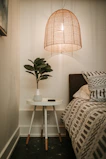 Cozy bedroom corner with soft lighting and practical home accessories