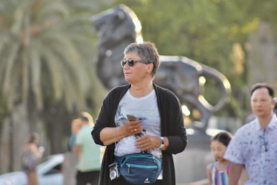 Lifestyle image of a person holding an eros shield case while walking in a modern urban setting.