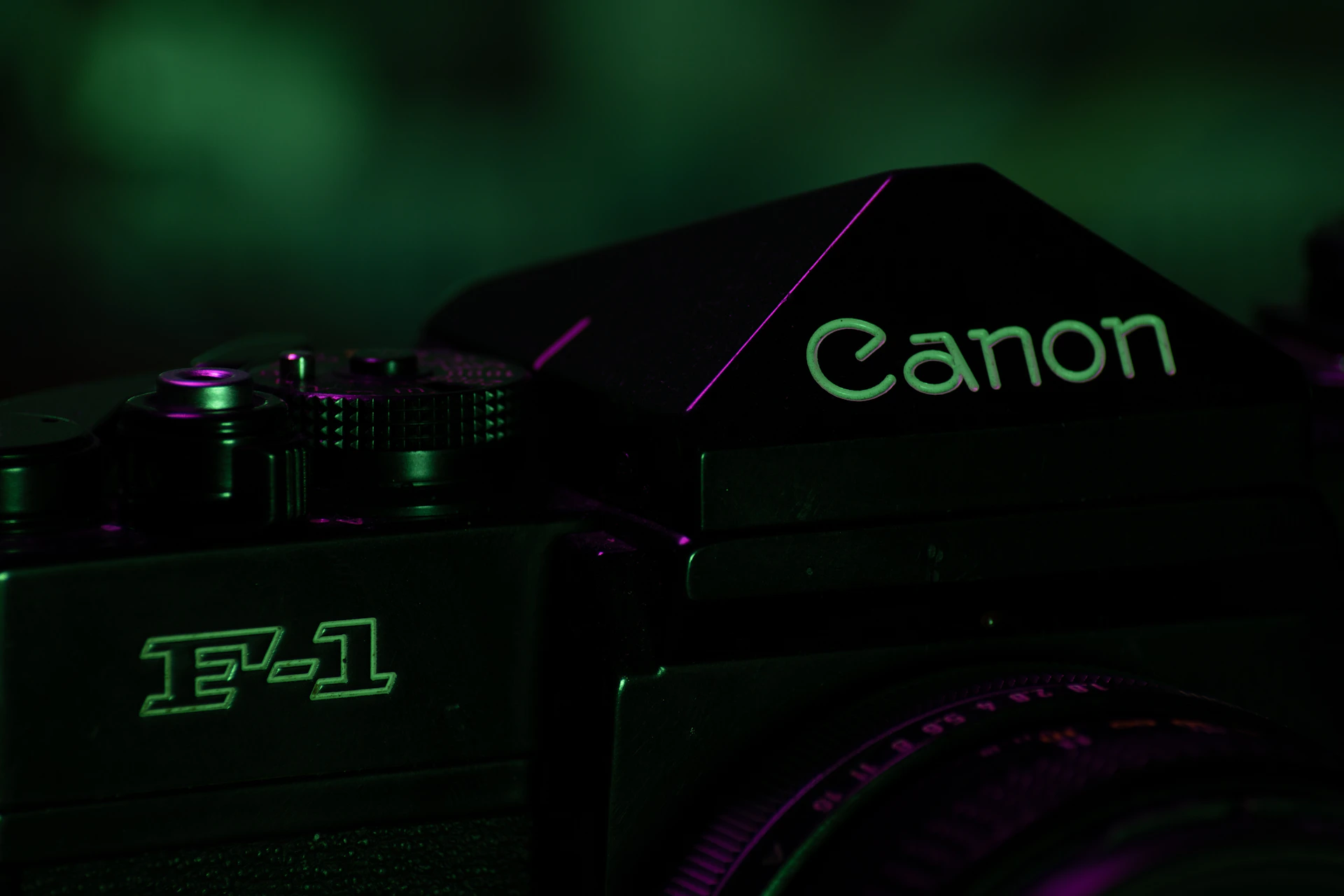 A close-up shot of a vintage film camera with glowing neon green accents, emphasizing the studio's blend of classic and modern audiovisual art.