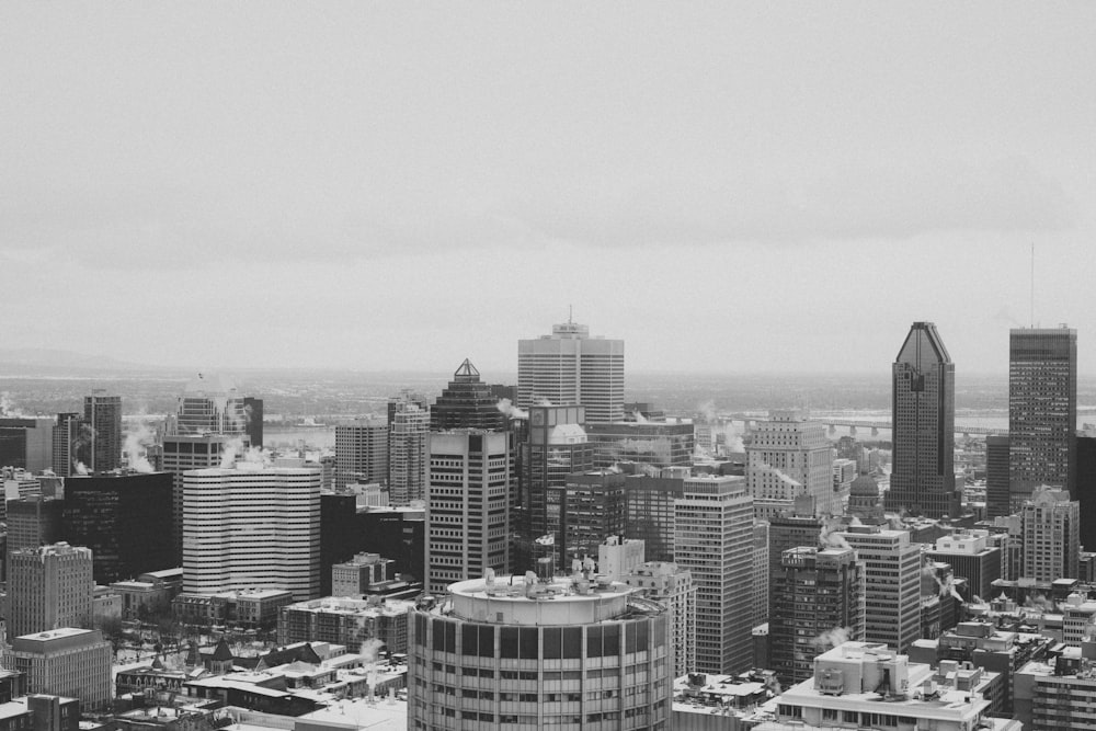 grayscale photo of city buildings during daytime