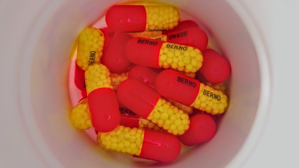 orange and yellow oval medication pill