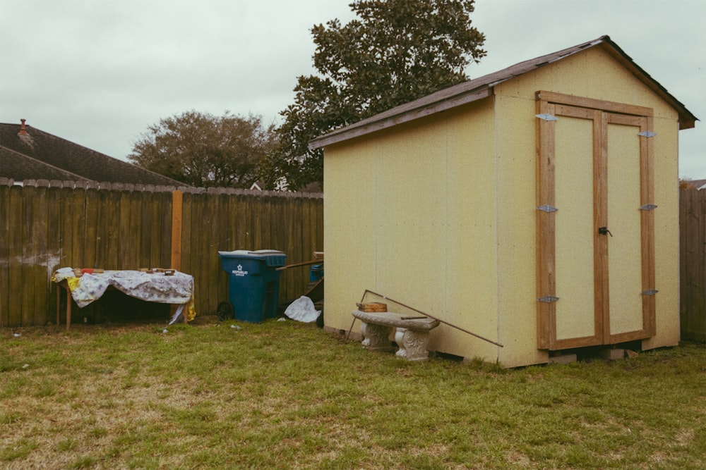 white and brown wooden shed