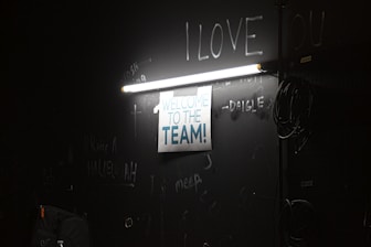 A welcoming team guiding a new employee through onboarding.