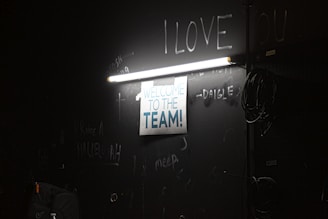A welcoming office desk with a softly glowing lamp and a handwritten note that reads 'Shea Foundation'.