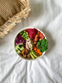 vegetable salad on white ceramic bowl