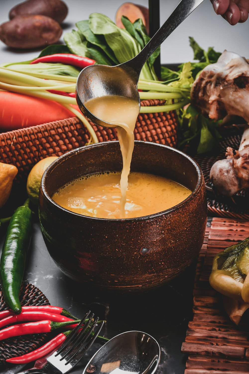 soup in black ceramic bowl