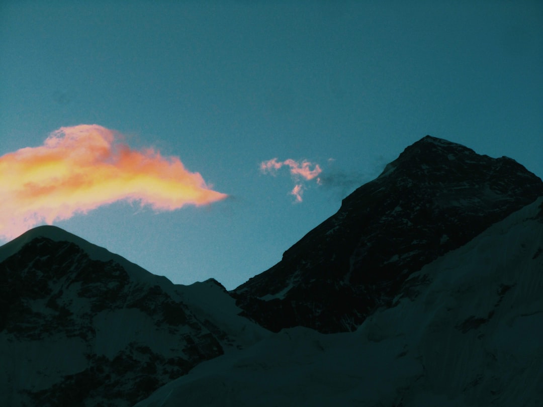 brown rocky mountain under blue sky