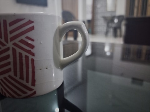 Close-up of a white ceramic mug with a detailed custom sublimation print