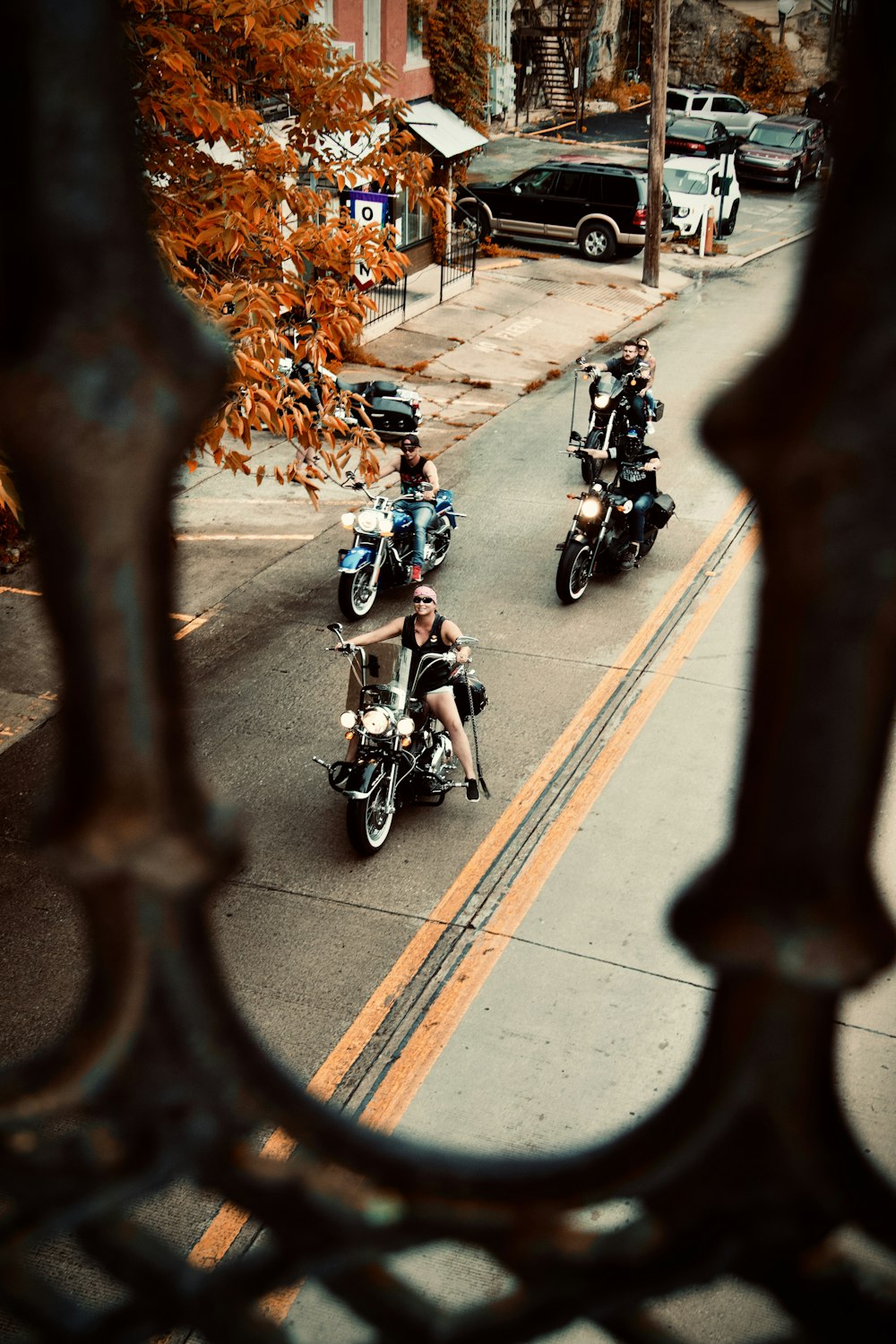 people riding motorcycle on road during daytime