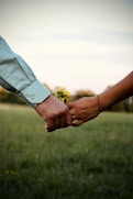 person holding yellow flower bouquet