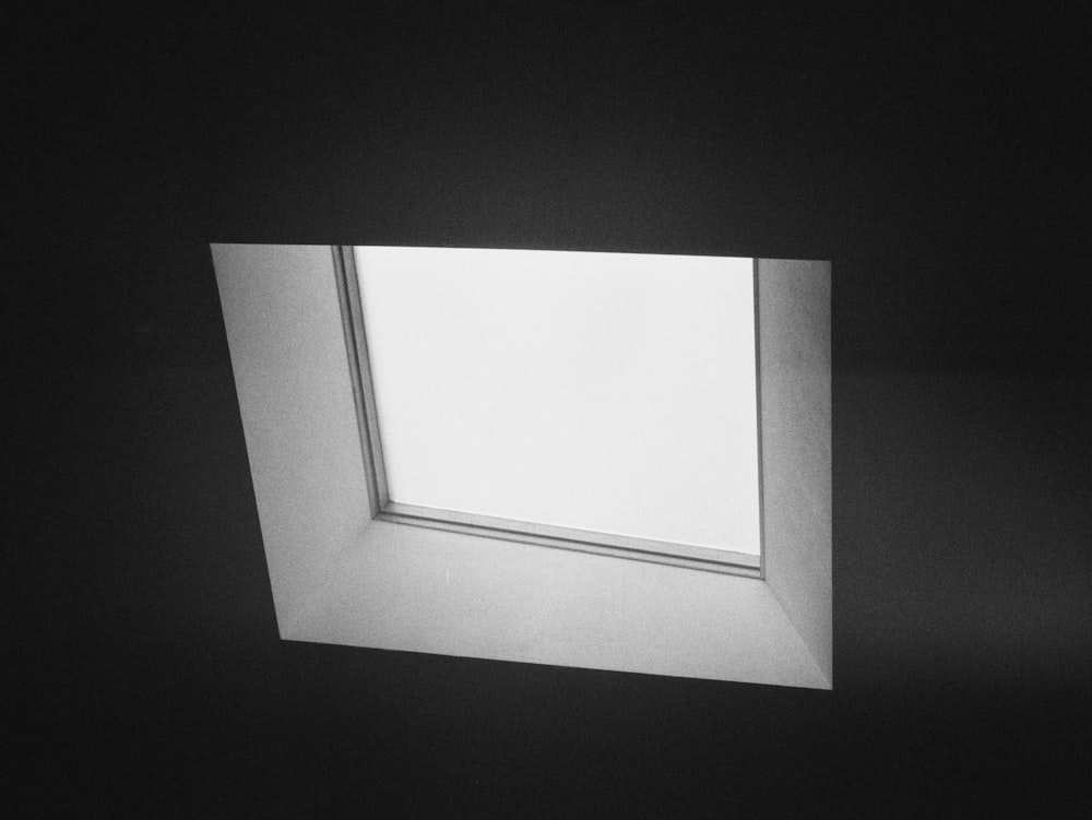 white rectangular frame on black surface