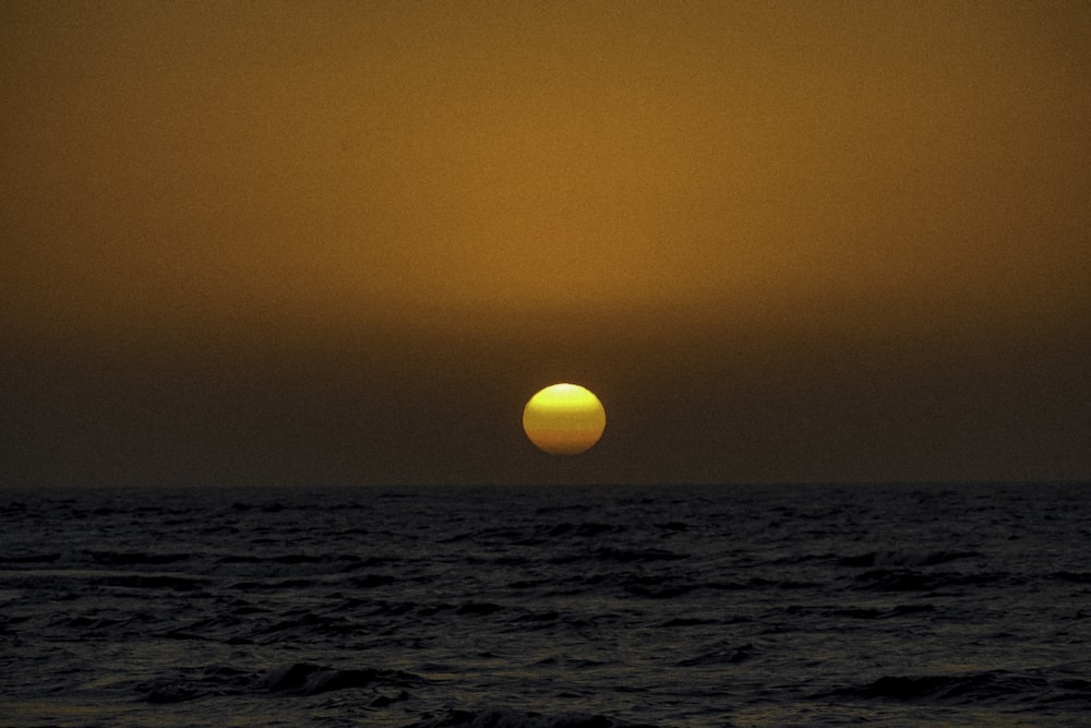 body of water during sunset