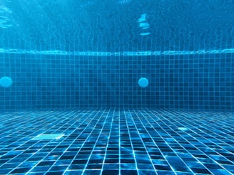 blue swimming pool with water