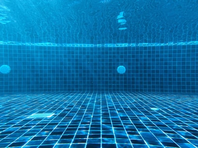blue swimming pool with water