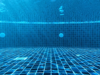 blue swimming pool with water