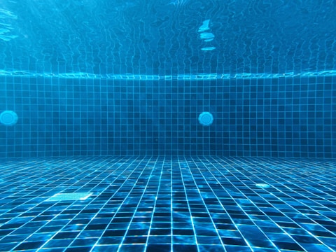 blue swimming pool with water