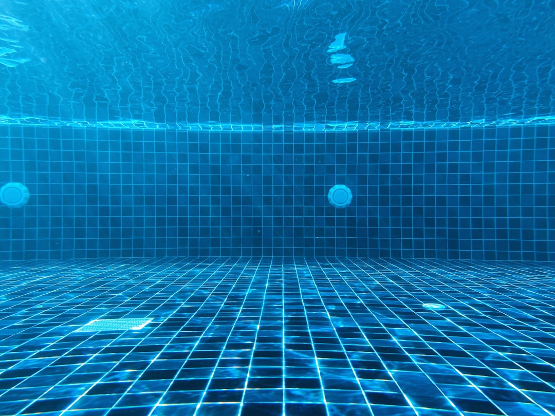 blue swimming pool with water,