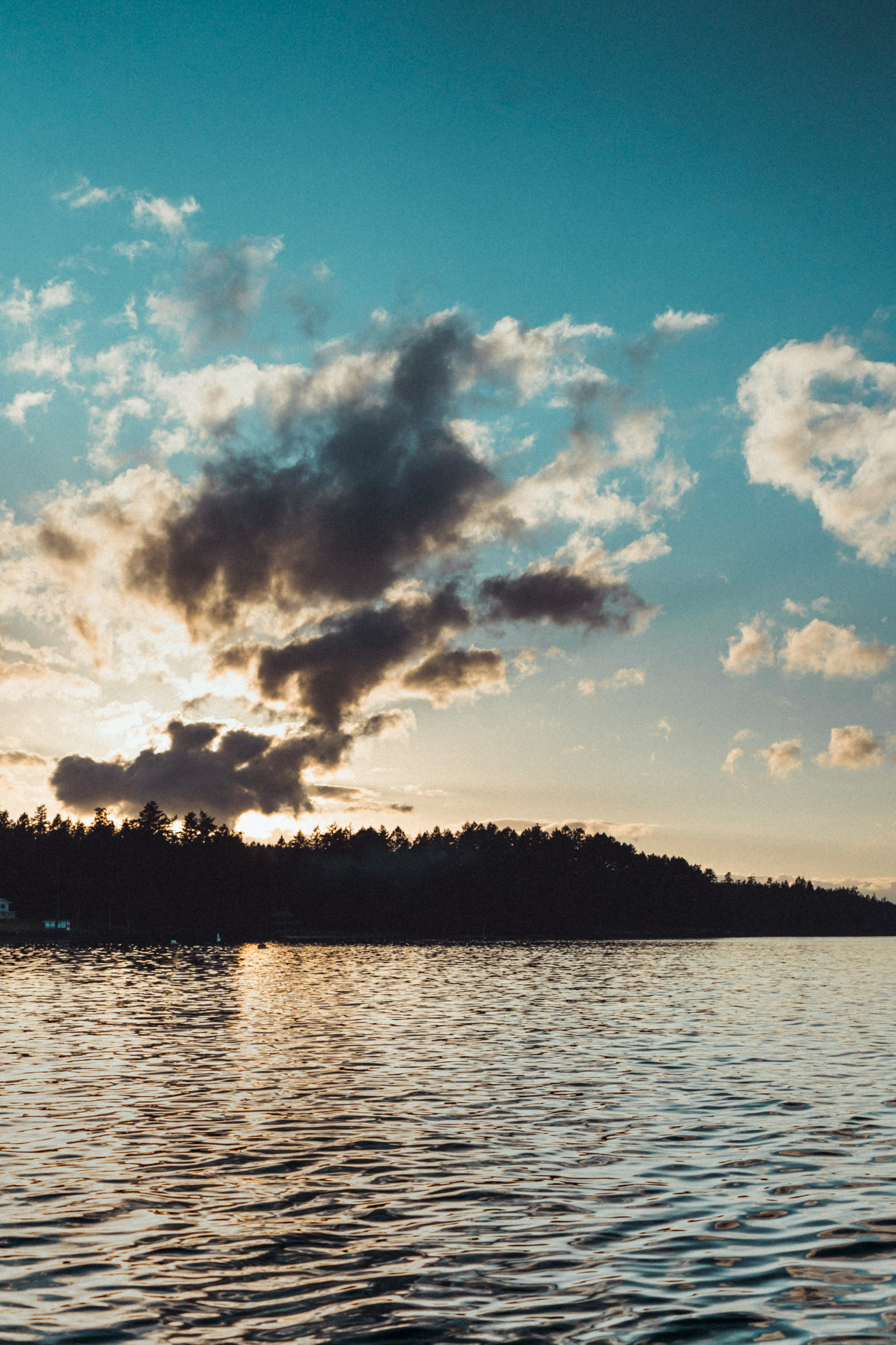 body of water under cloudy sky during daytime