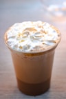 white and brown ice cream in clear glass cup