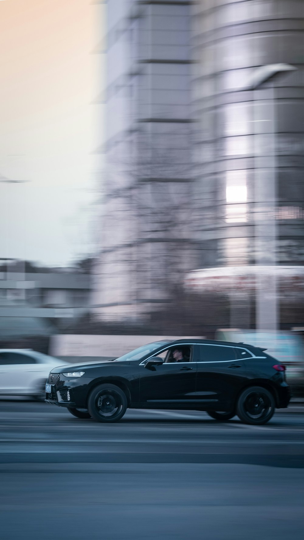 black sedan on road during daytime