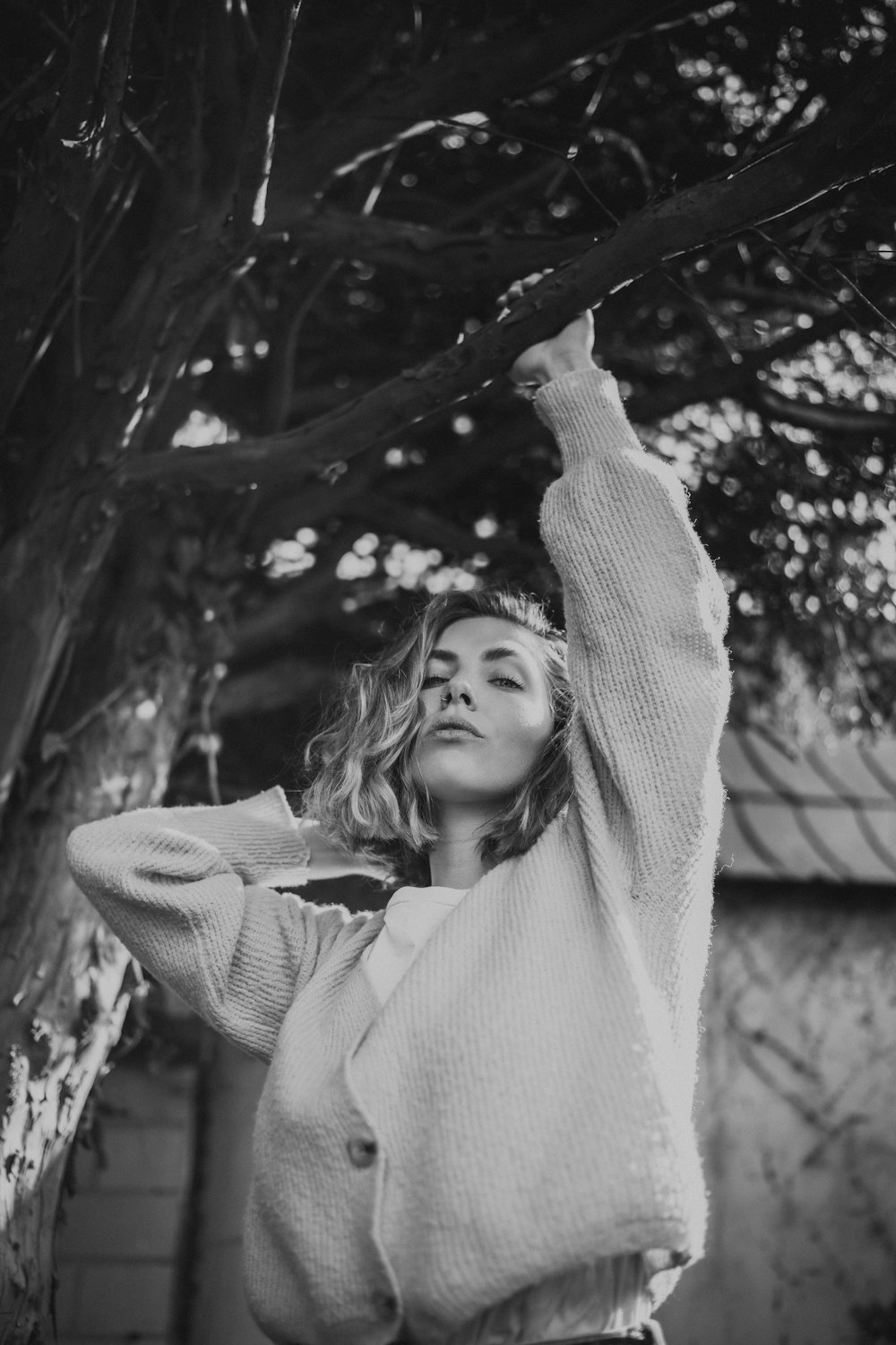 grayscale photo of girl in white long sleeve shirt