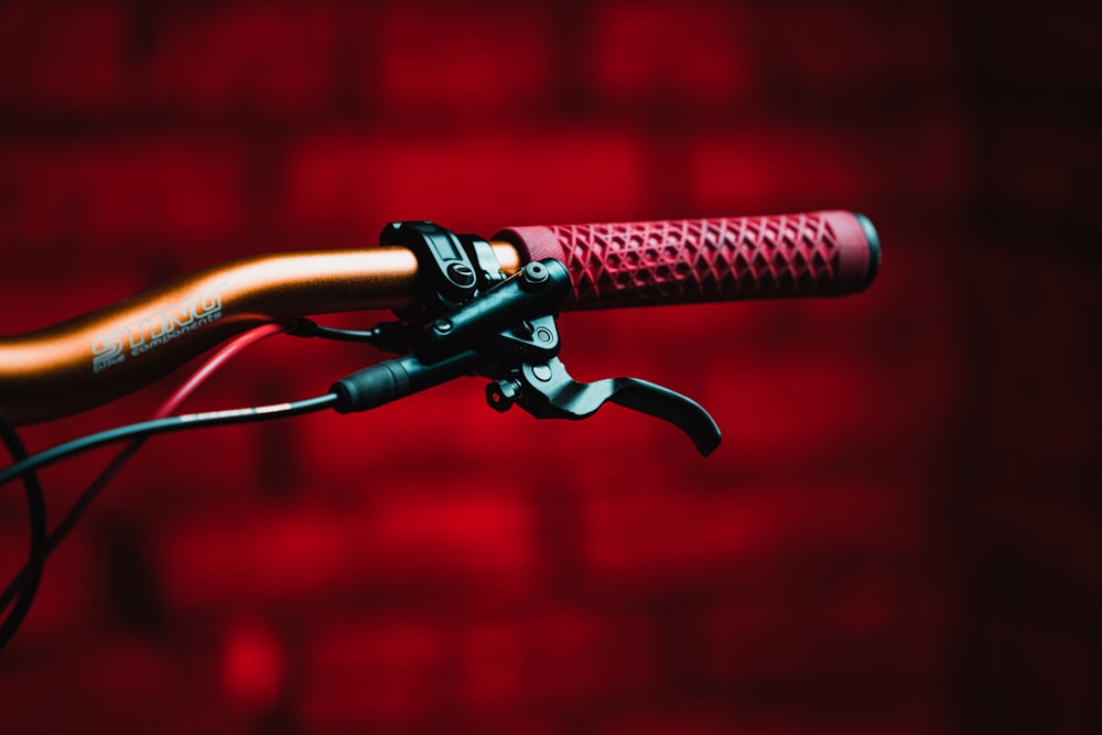 black and red bicycle handle bar