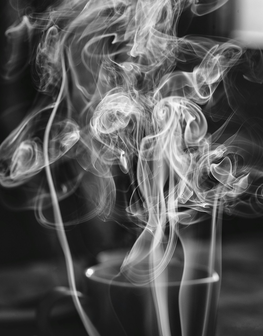 grayscale photo of smoke on black background
