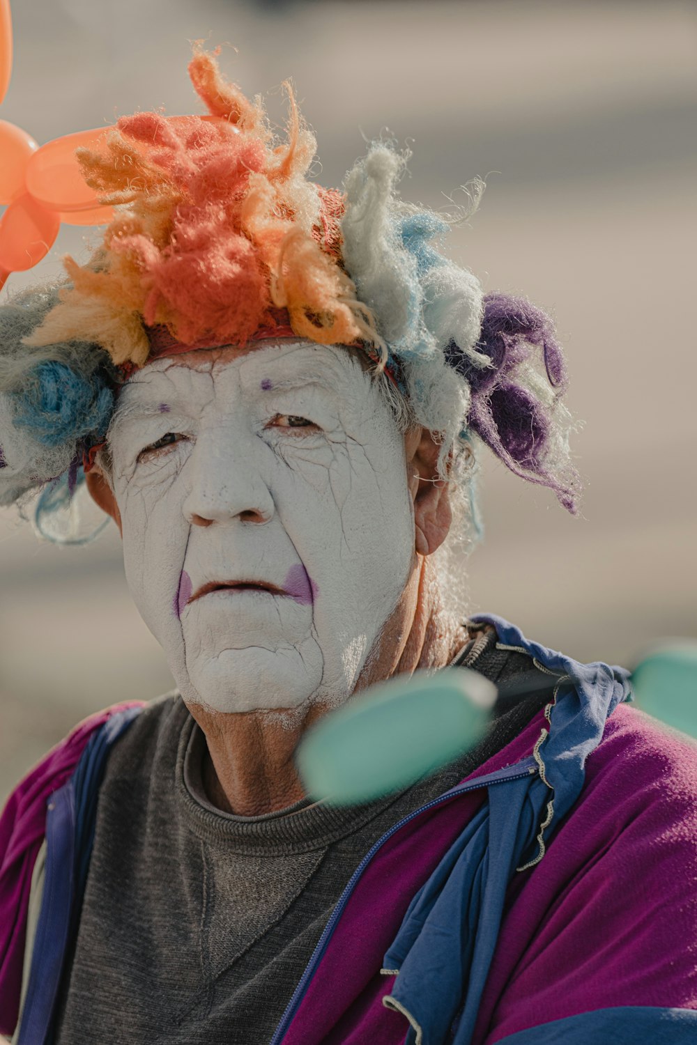 woman in purple and black jacket with white and yellow flower headdress