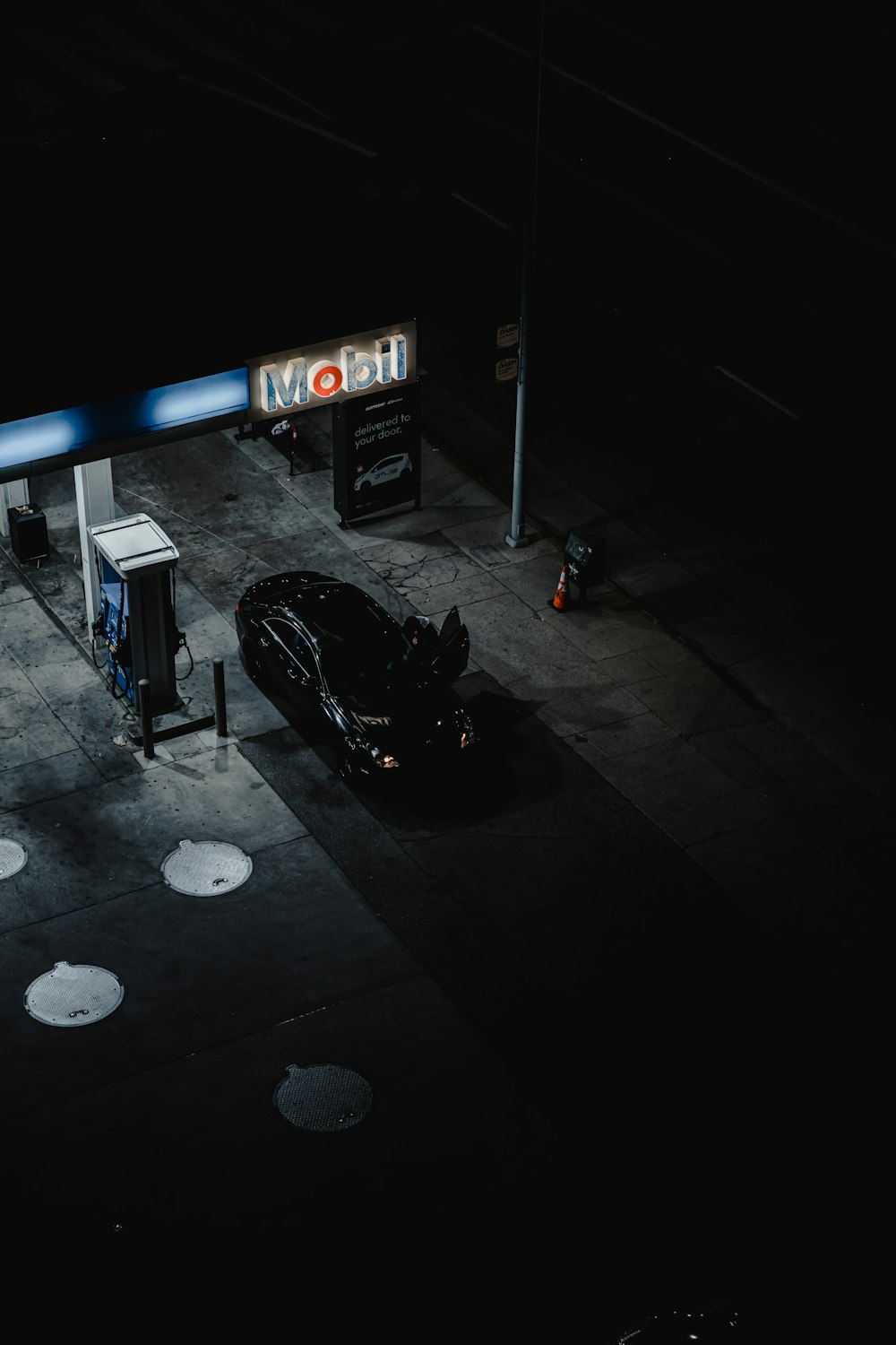 black car parked on parking lot during night time