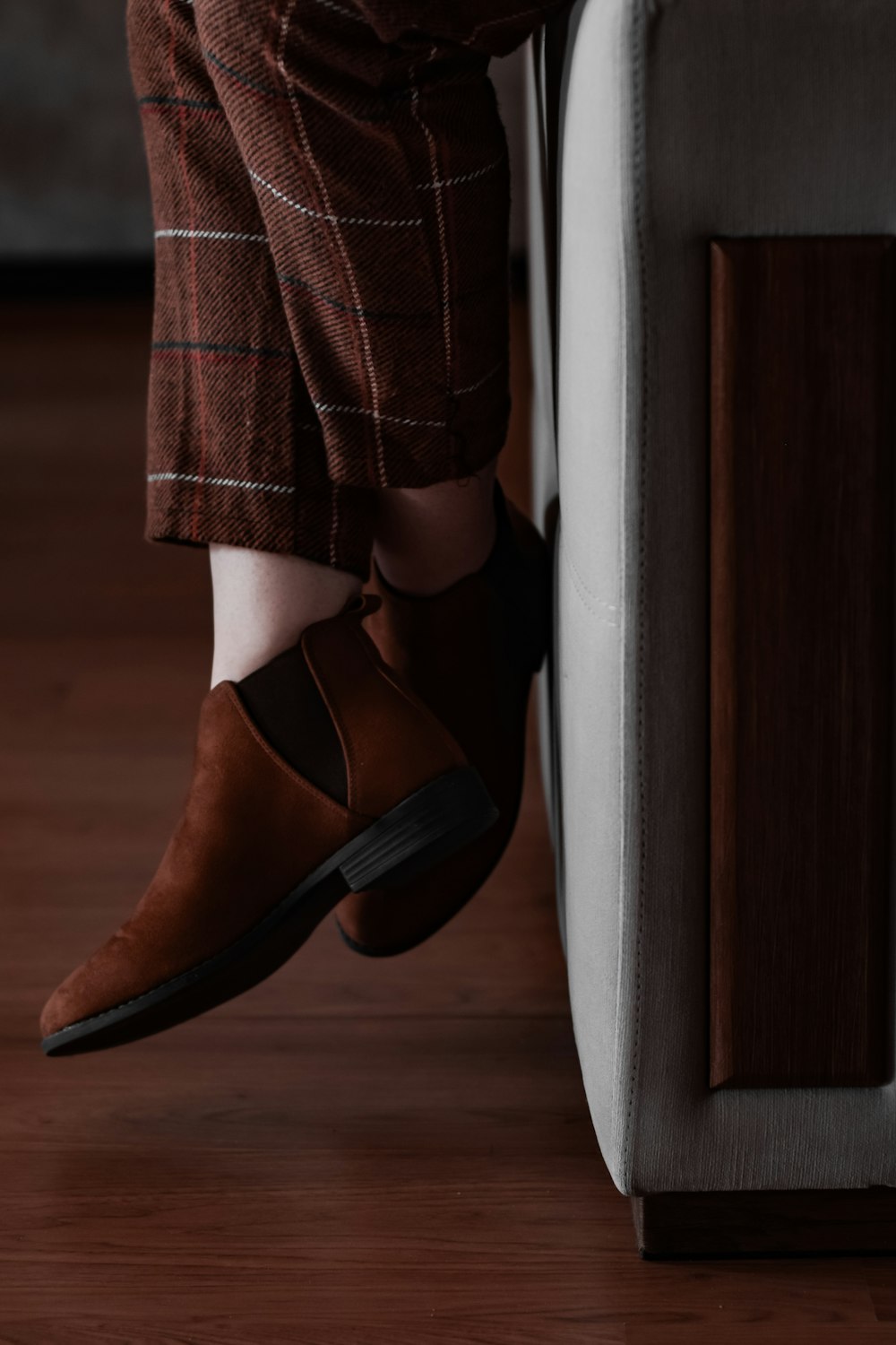 woman in brown leather heeled shoes