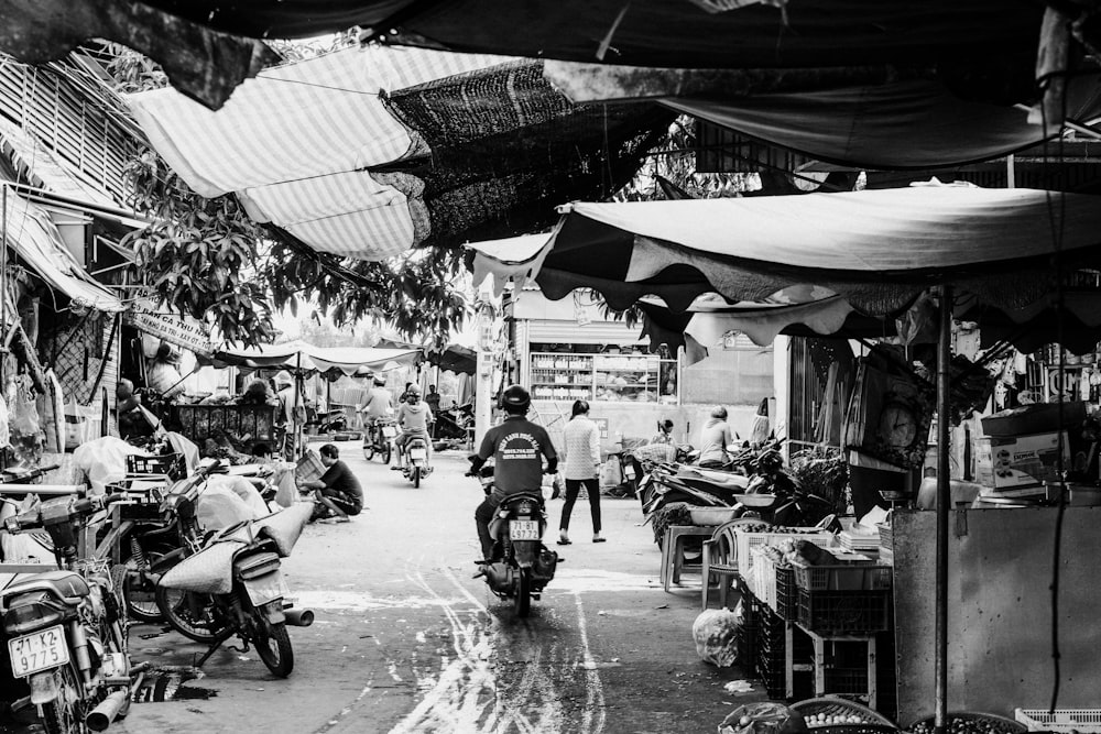 grayscale photo of people walking on street