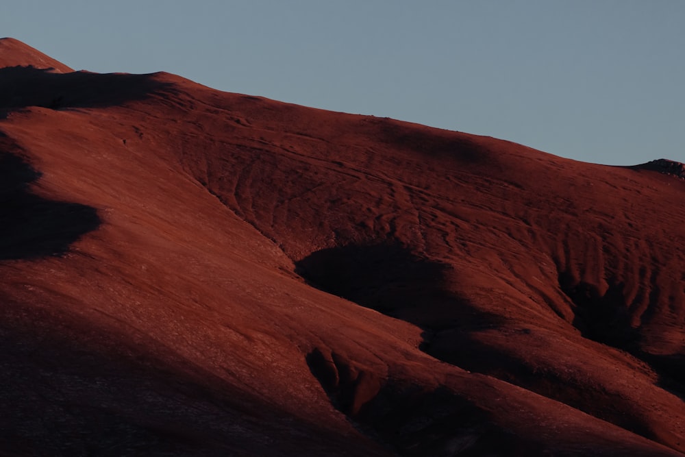 brown mountain under blue sky during daytime