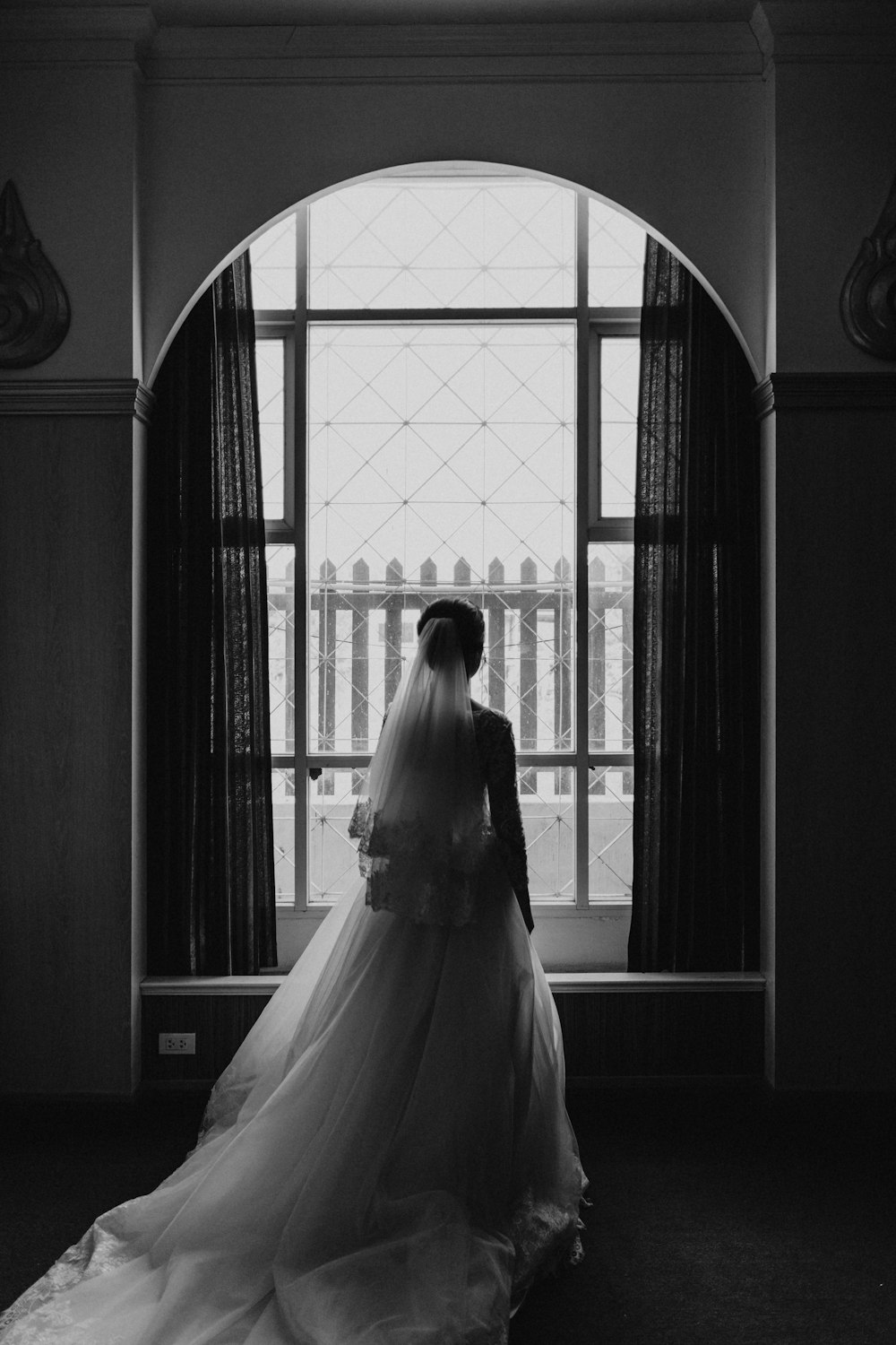 grayscale photo of couple in wedding dress