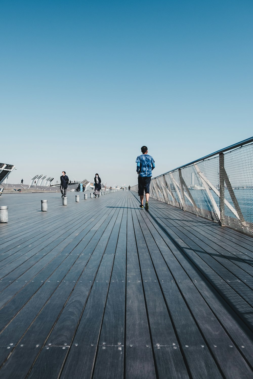 people walking on wooden dock during daytime