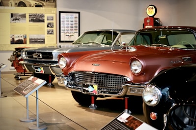 red classic car in a parking lot