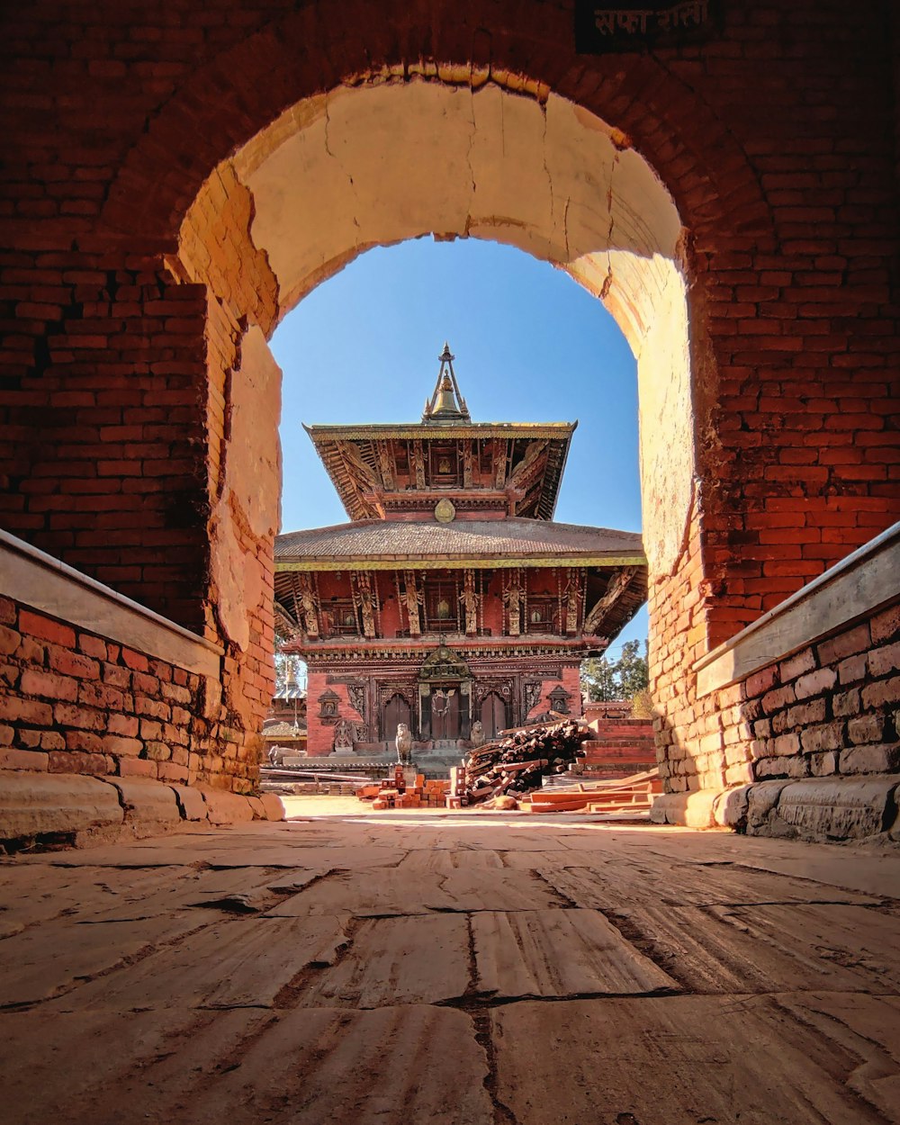 brown brick building with arch shaped windows