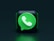 A 3D representation of a green chat bubble with a white phone icon inside, placed on a dark green background. The icon is similar to a well-known messaging app symbol.