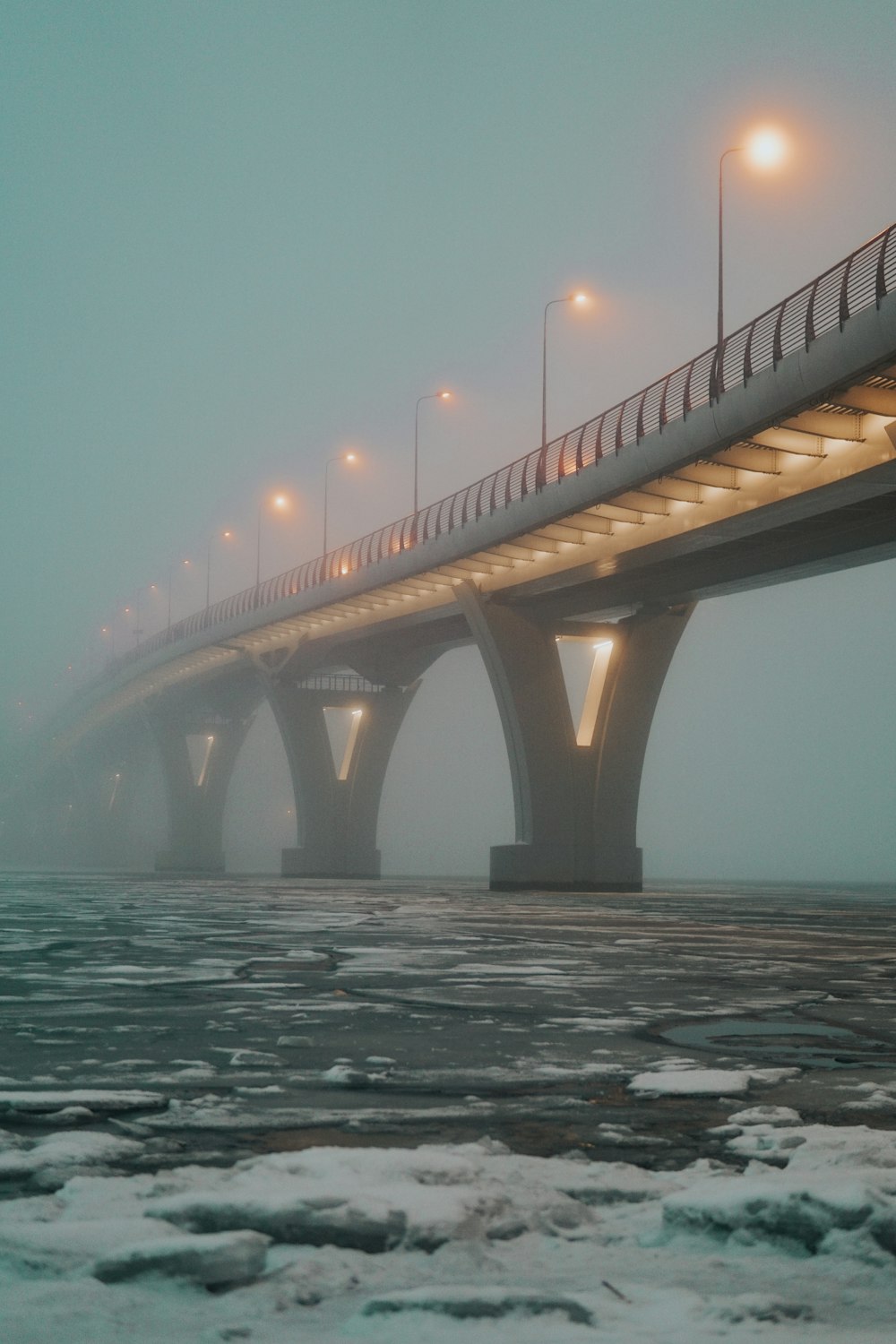 brown bridge over the sea during daytime