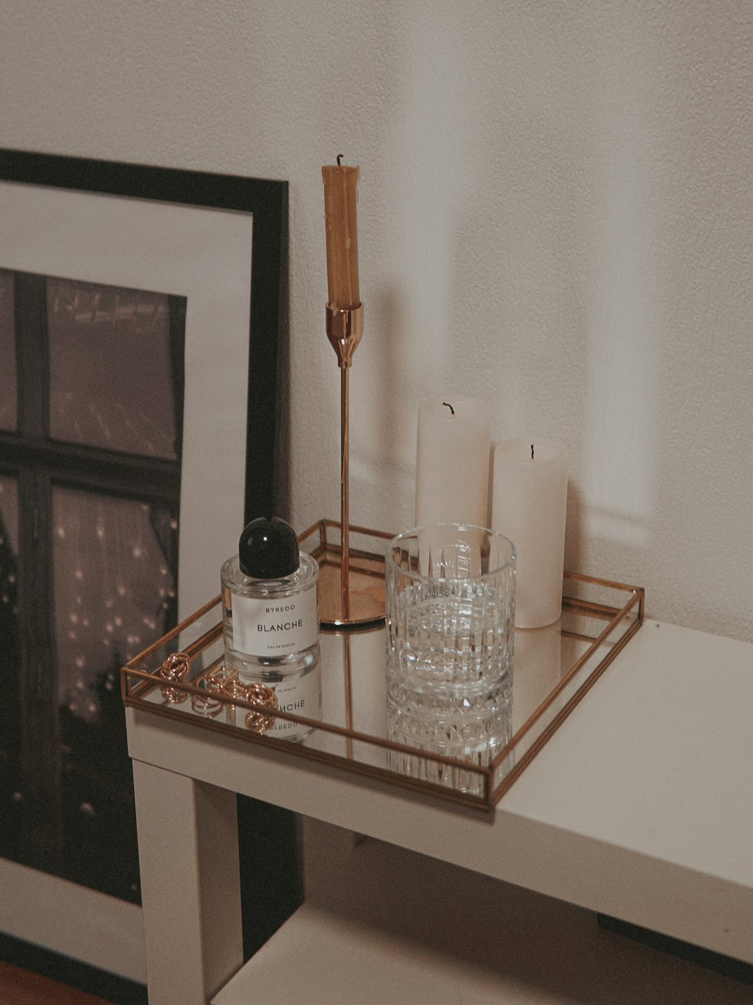 clear drinking glass on white wooden table