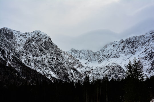 snow covered mountain during daytime in Jezersko Slovenia
