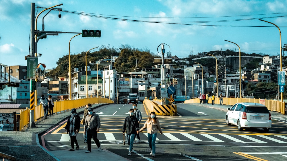 people walking on pedestrian lane during daytime