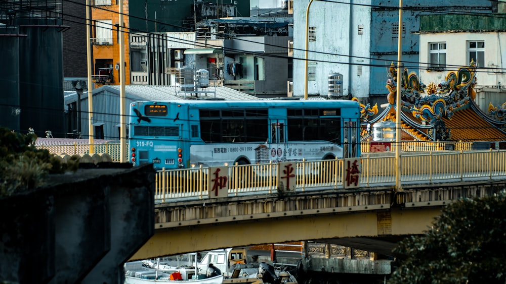 blue and white bus on road during daytime