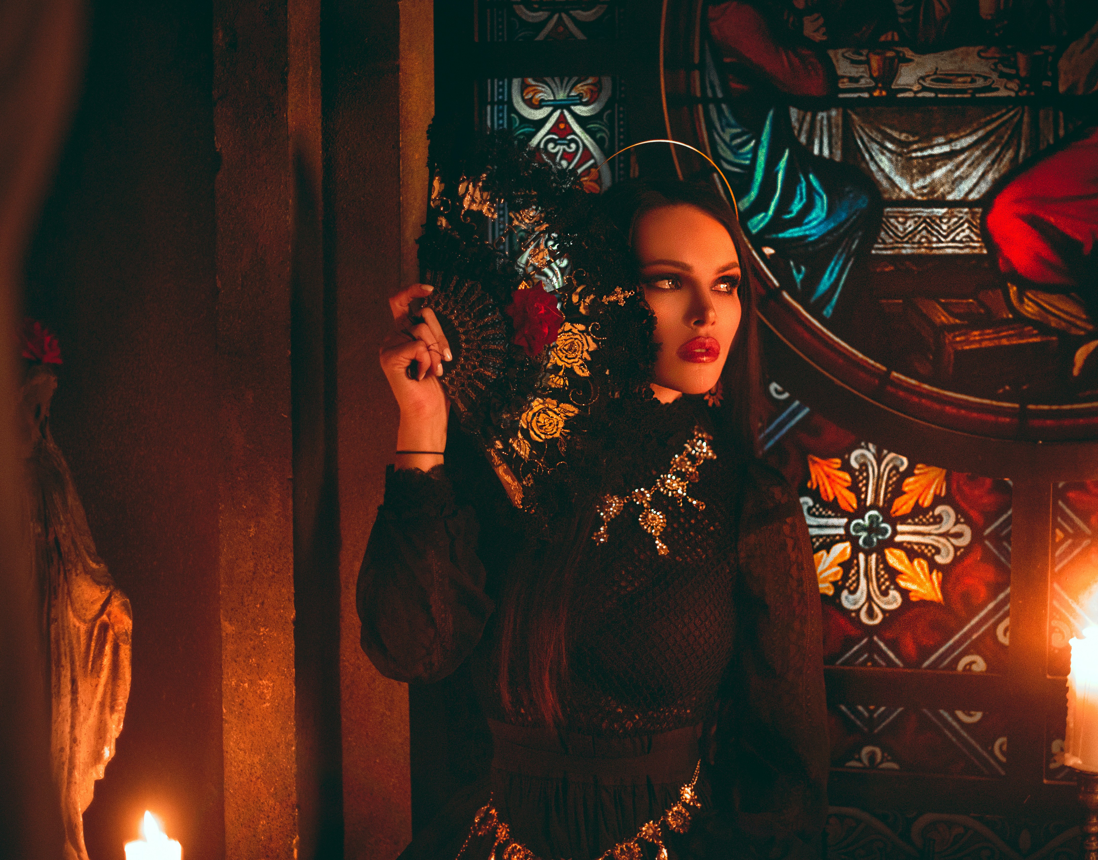 woman in black and brown long sleeve dress standing beside brown wooden door