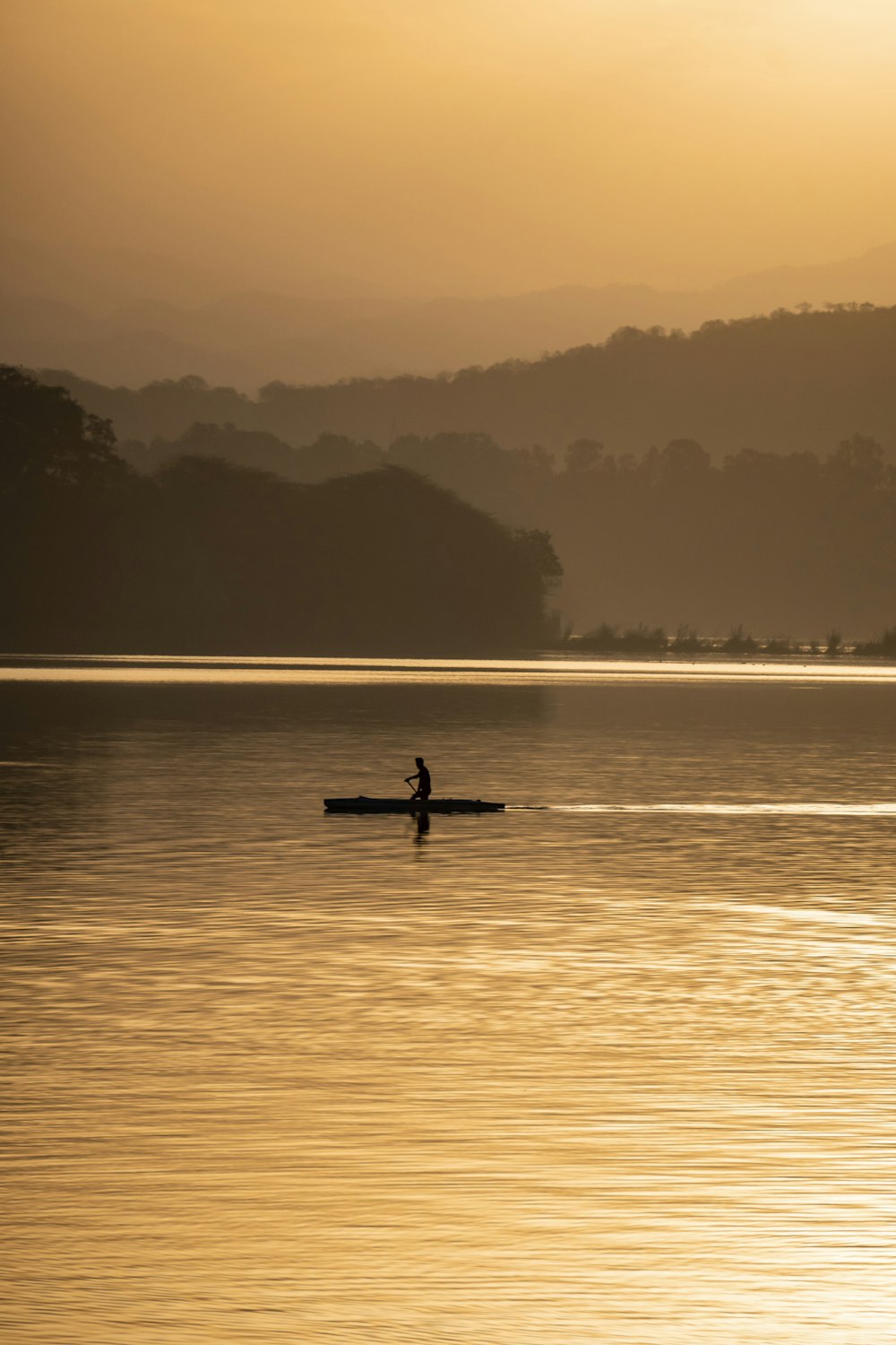 person riding on boat on sea during daytime