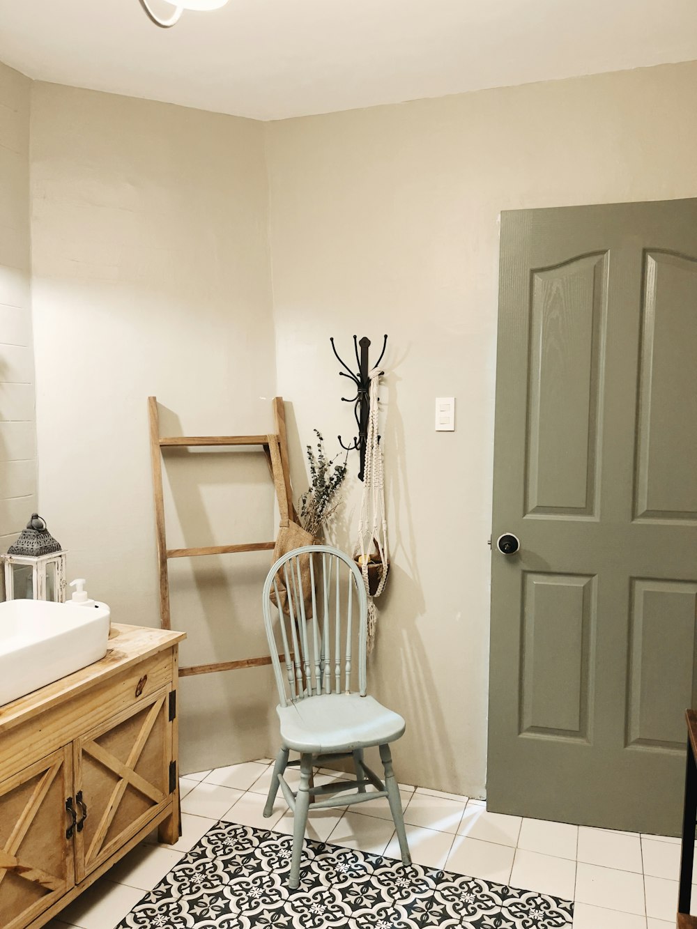 white wooden door beside white ceramic sink