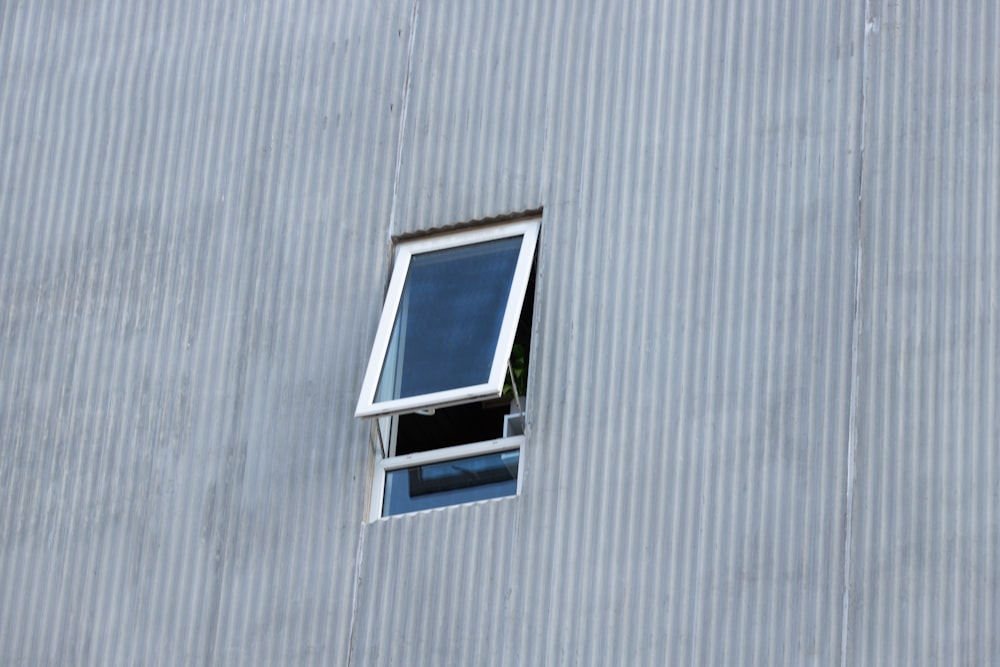 white and blue window type air conditioner