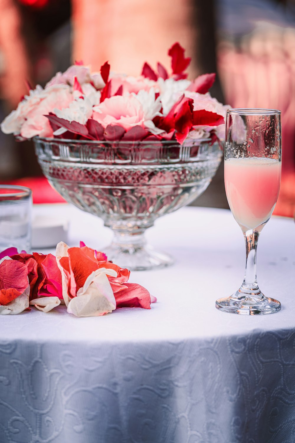 pink rose bouquet in clear glass wine glass