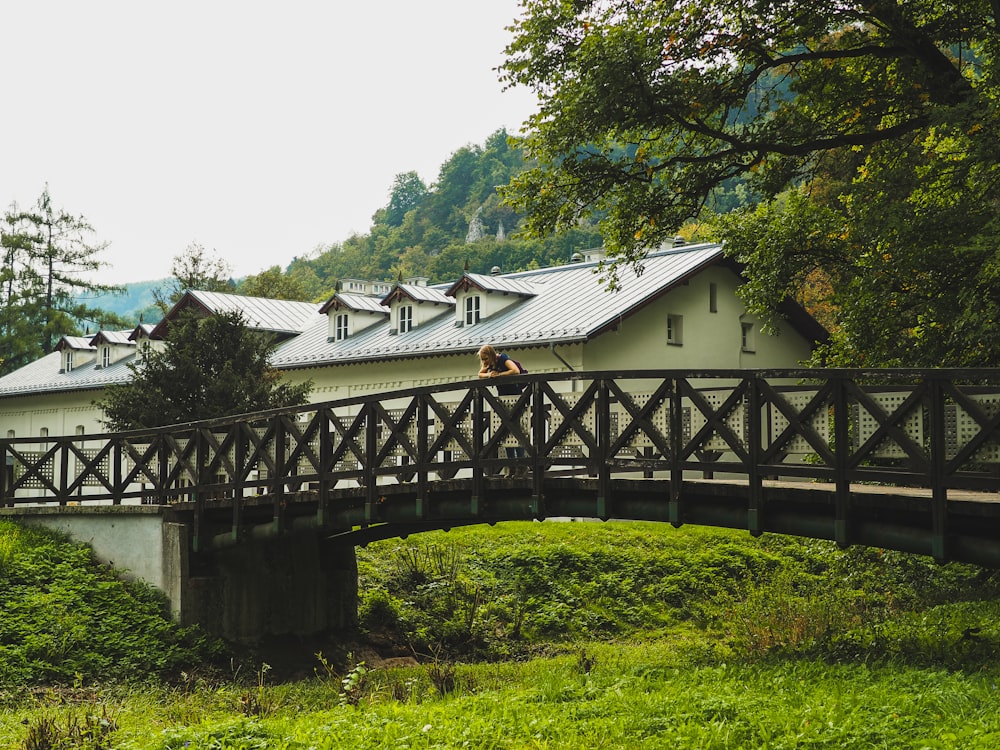 brown wooden house near green trees during daytime